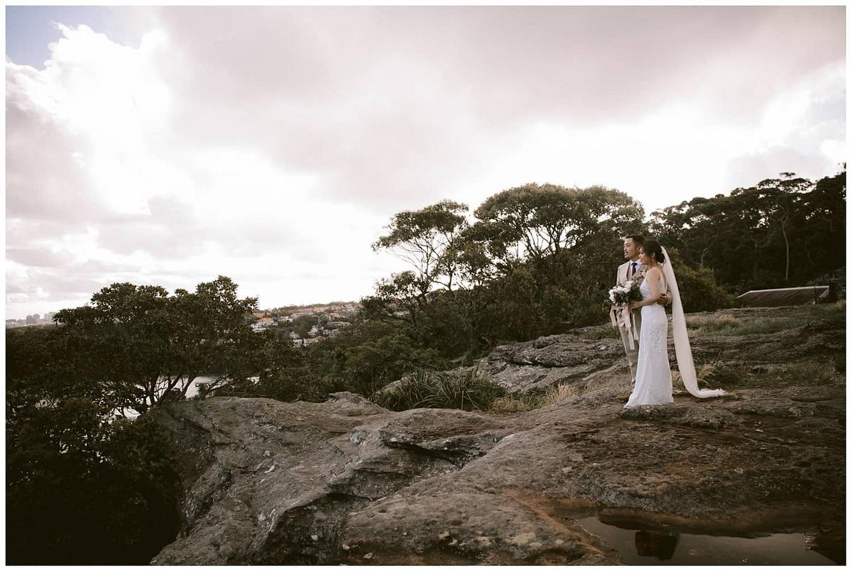 Bride and groom admiring the Sydney Harbour at Georges Head Lookout, Gunners Barracks Mosman.