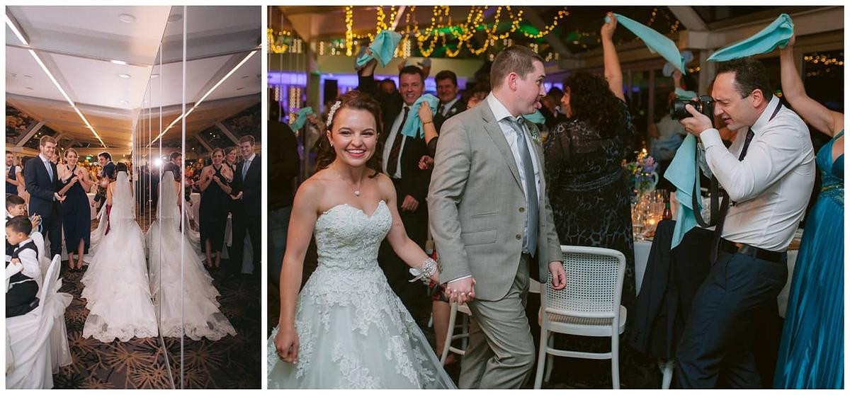 bridal enBride and groom walking into the reception as guests cheer and clap at Luna Park Sydney.